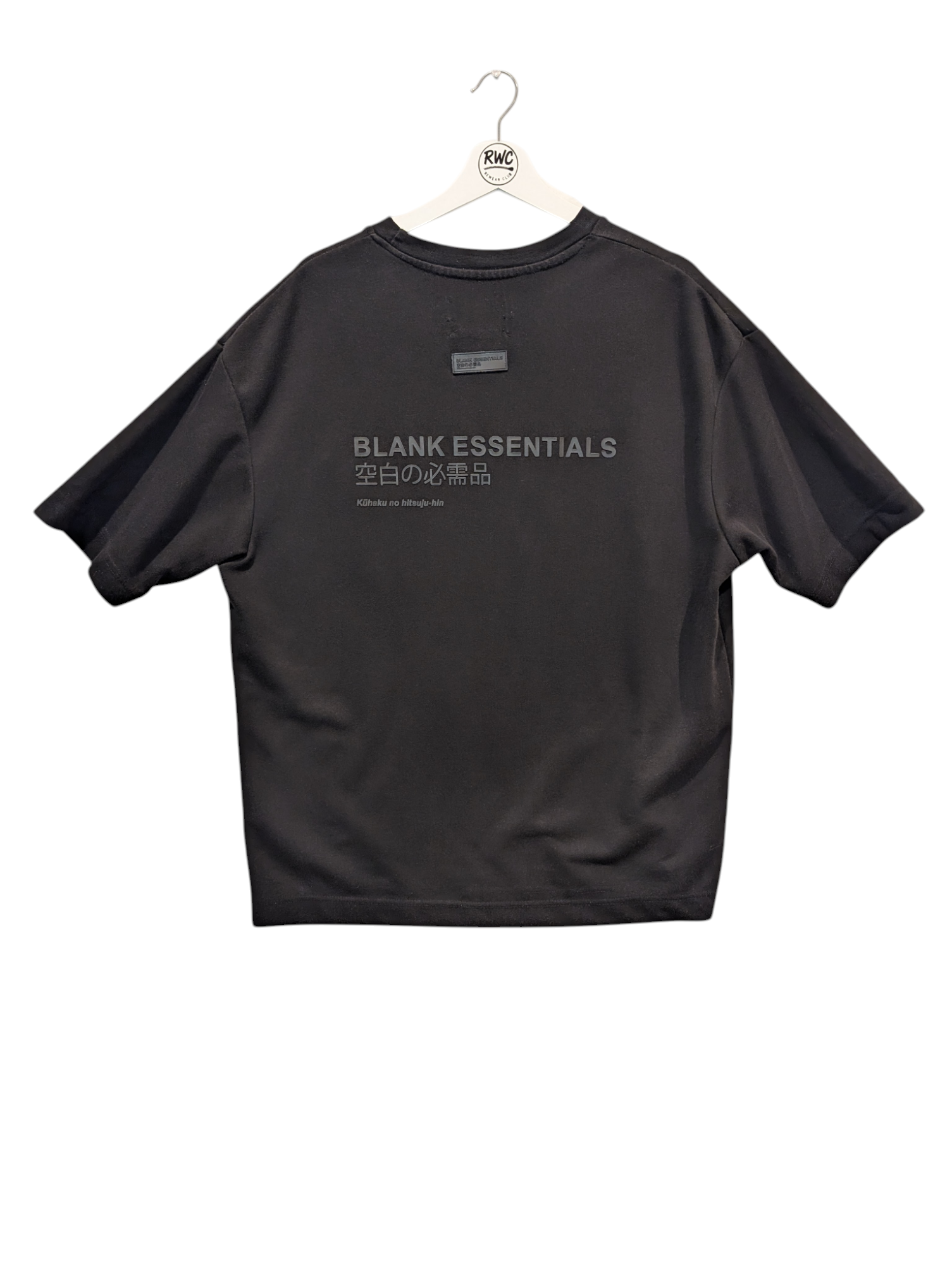 Black t-shirt with 'Blank Essentials' text on a white background