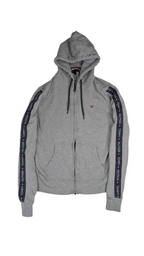 Gray hoodie with brand logos on sleeves against a white background Tommy Hilfiger 